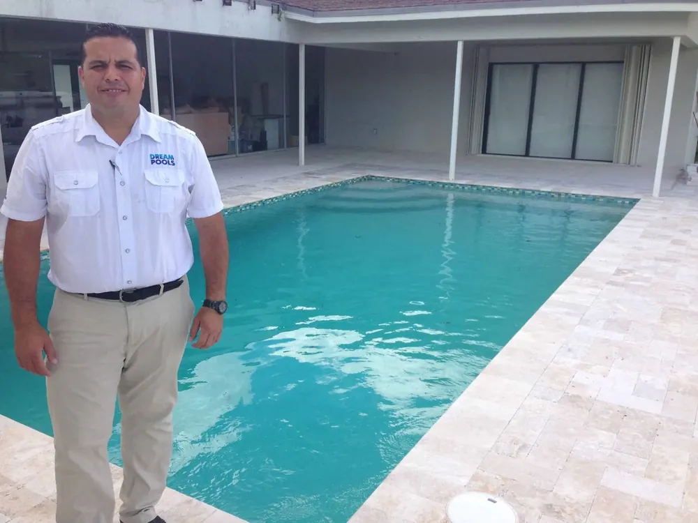 New construction swimming pool with custom decking in Miami-Dade