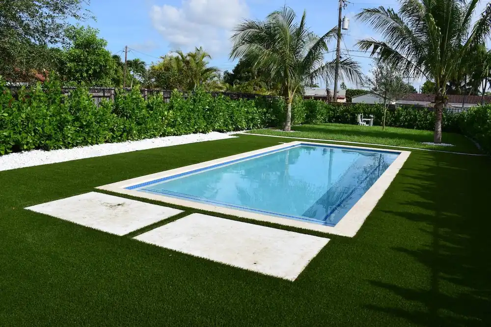 New construction swimming pool with custom decking in Miami-Dade