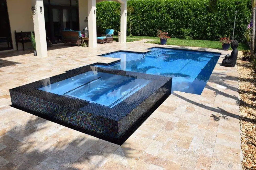 New construction swimming pool with custom decking in Miami-Dade