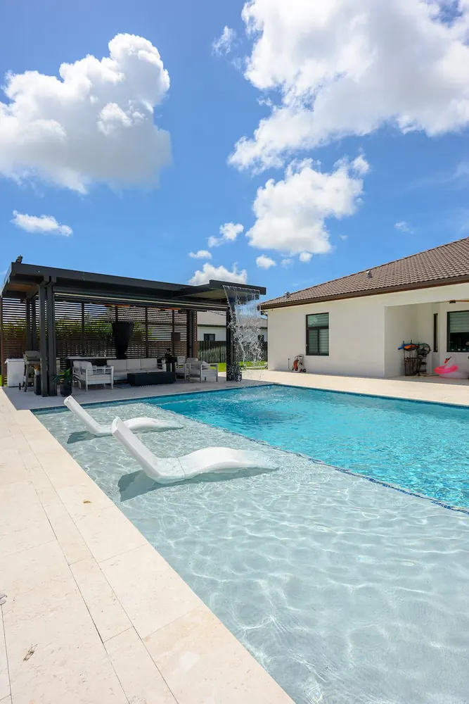 Inground pool with spa and water features in Miami-Dade County