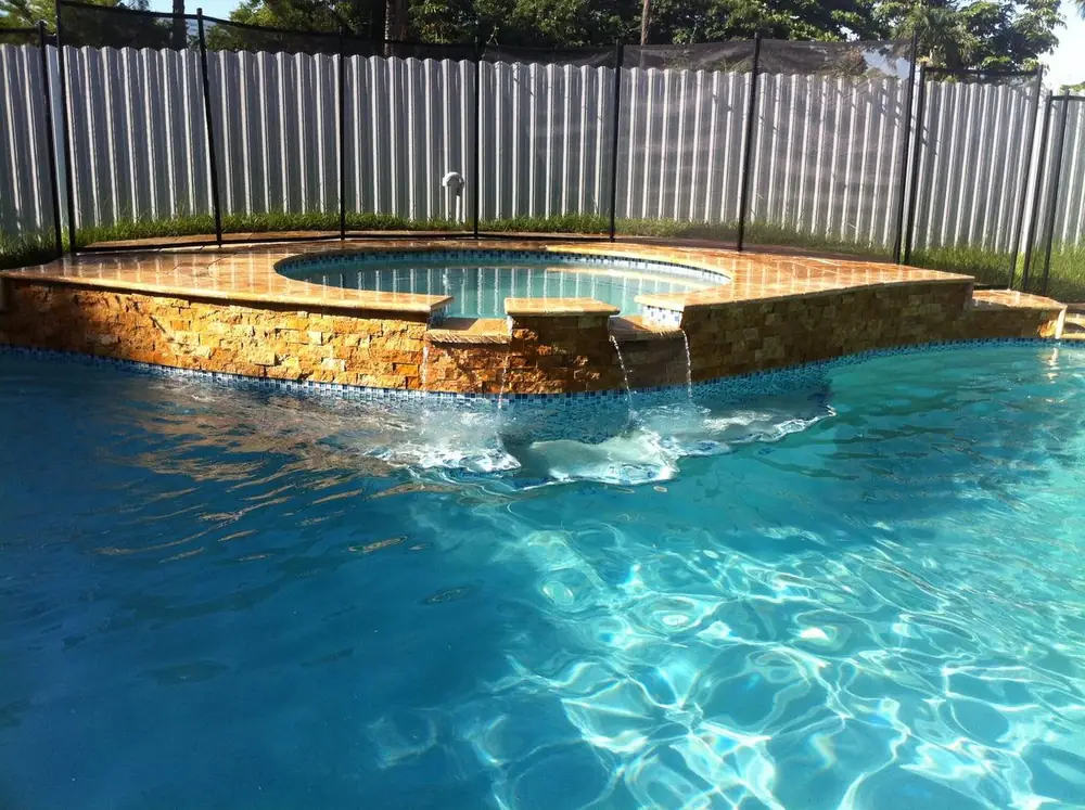 Inground pool with spa and water features in Miami-Dade County