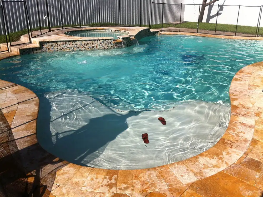 New construction swimming pool with custom decking in Miami-Dade