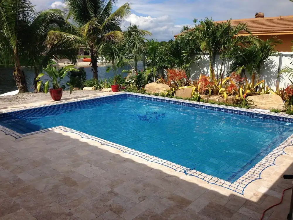 New construction swimming pool with custom decking in Miami-Dade