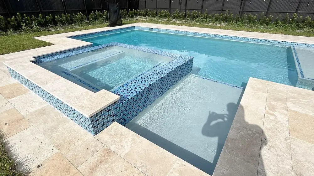New construction swimming pool with custom decking in Miami-Dade